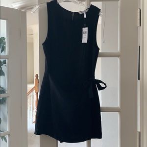 Little black romper with tie in the front